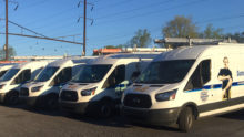 5 Summers & Zim's work vans parked in a line