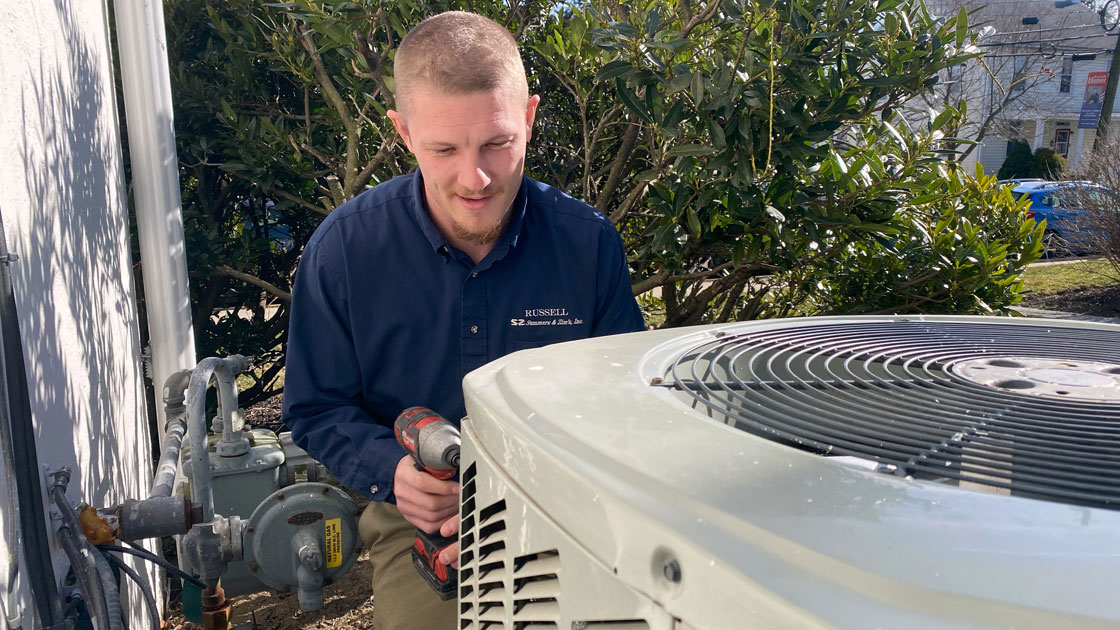 Technician Working on an Air Conditioning Unit