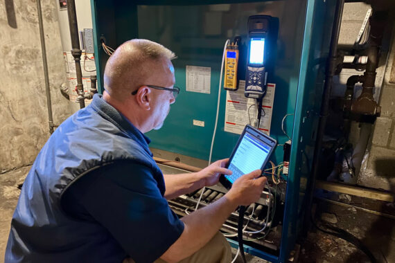 Expert technician performing emergency maintenance on a steam boiler in Lancaster County, ensuring optimal HVAC performance.