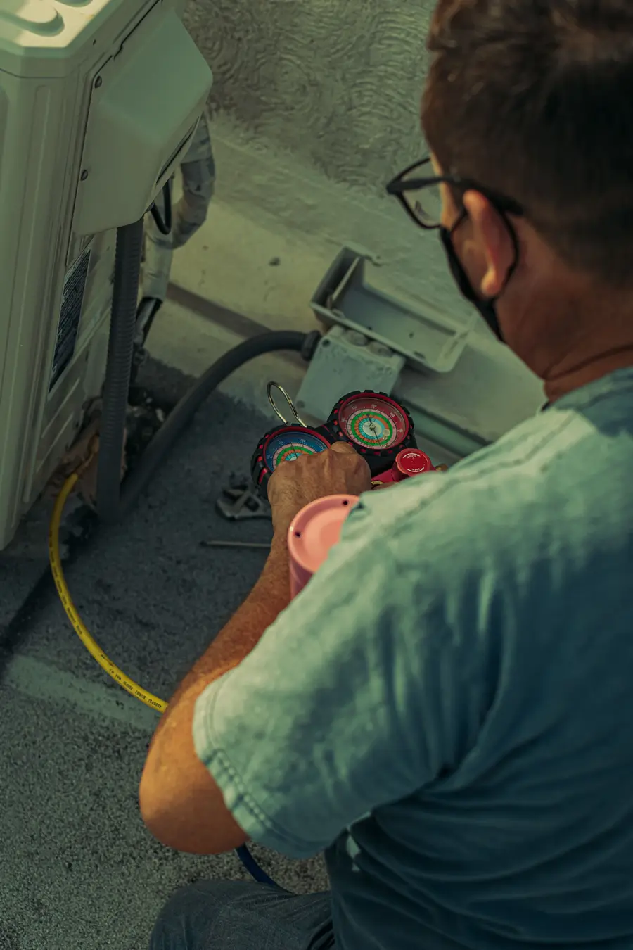 air-conditioning-repair-downington-technician-using-leak-detector-on-ac-coil